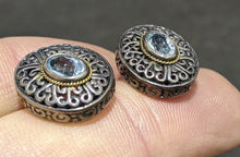 Load image into Gallery viewer, Sterling Silver &amp; 18 Kt Yellow Gold Blue Topaz Stud Earrings
