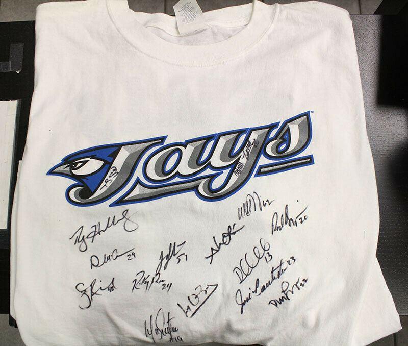 A Toronto Blue Jays Autographed Tee Signed by 2009 Roster w/ Halladay, Bautista