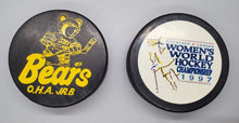 Load image into Gallery viewer, Hockey Pucks Lot - Bears &amp; Kitchener Women&#39;s World Hockey Championship
